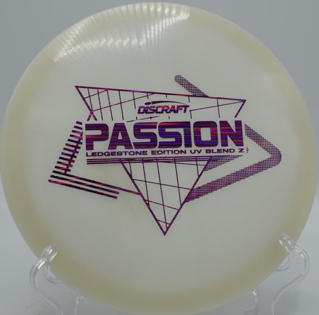 Paige Pierce UV Z Passion ripping through the fairway at Kensington Metropark in Michigan, showcasing effortless glide and subtle turn