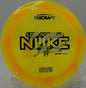 Side profile of a Z Swirl Nuke lying near the OB line at Glenwood Springs Disc Golf Course in Colorado

