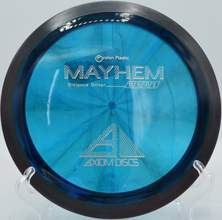 Proton Mayhem ripping on a forehand laser through a crosswind, showing torque resistance and reliable fade at Northwood Black.

