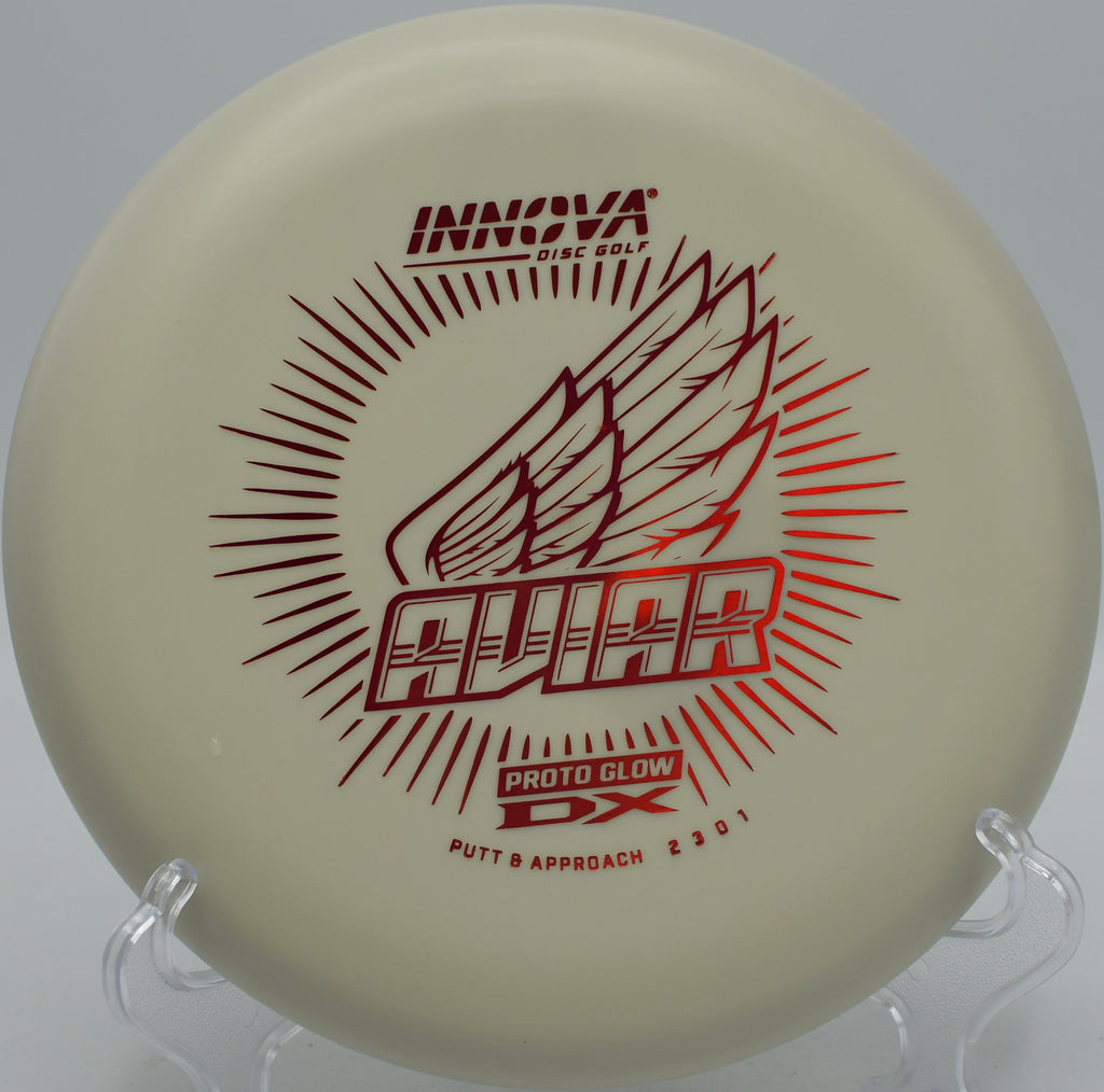 Glow DX Aviar putter glowing under UV light at Morley Field Disc Golf Course in San Diego, California