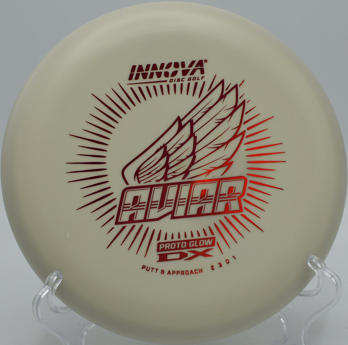 Glow DX Aviar putter glowing under UV light at Morley Field Disc Golf Course in San Diego, California