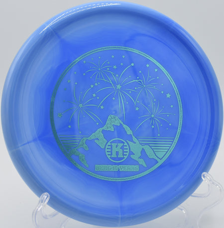 K1 Swirl Berg sticking the landing on a rocky green at Rockwall Disc Golf Course in Rockwall, Texas