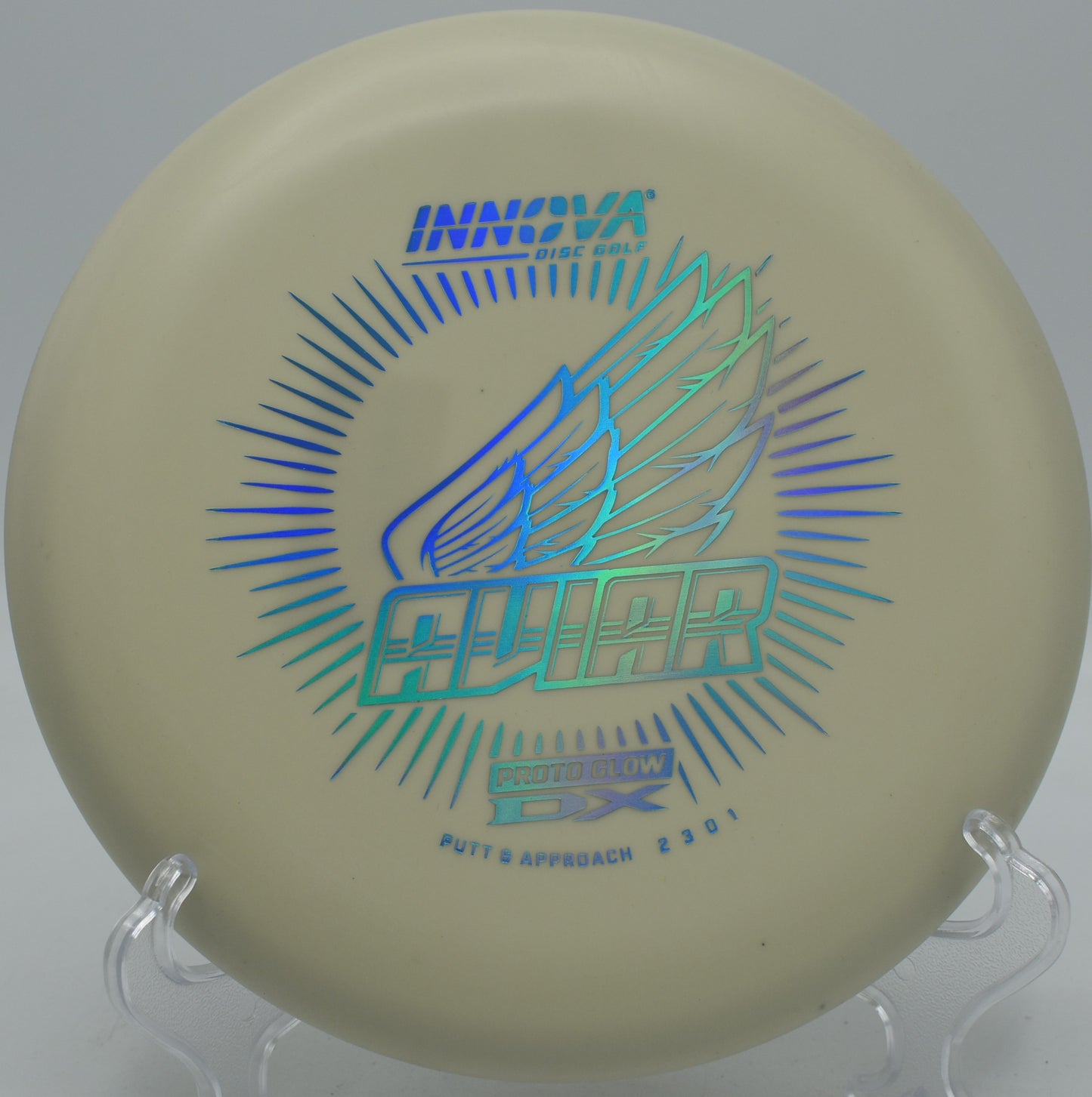 Glow DX Aviar disc glowing during a putt at Northwood Black in Morton, Illinois