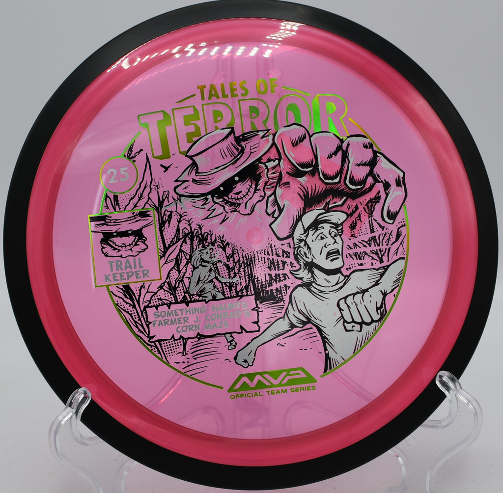 MVP Halloween Trail disc with Proton plastic sailing straight through trees at Oggwood Disc Golf Course in Cedar Hill, Tennessee