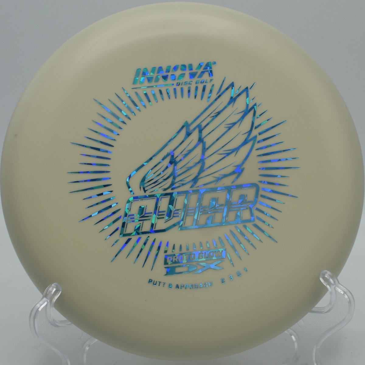 Innova DX Glow Aviar putter parked under basket chains after a clean circle-1 putt at Cedar Creek Park Disc Golf Course in Fairmont, West Virginia