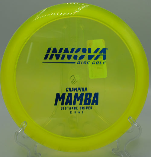 An Innova Champion Mamba landing softly on the green at Maple Hill Disc Golf Course in Leicester, Massachusetts, following a controlled understable drive.