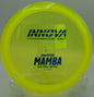 An Innova Champion Mamba landing softly on the green at Maple Hill Disc Golf Course in Leicester, Massachusetts, following a controlled understable drive.