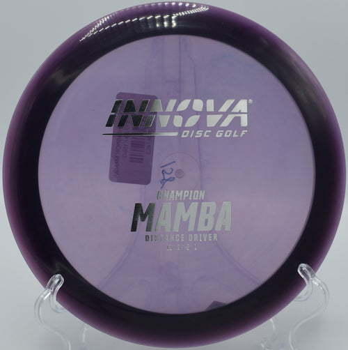 An Innova Champion Mamba hugging the right side of the fairway at Rollin Ridge Disc Golf Course in Reedsville, Wisconsin, threading a perfect turnover shot.