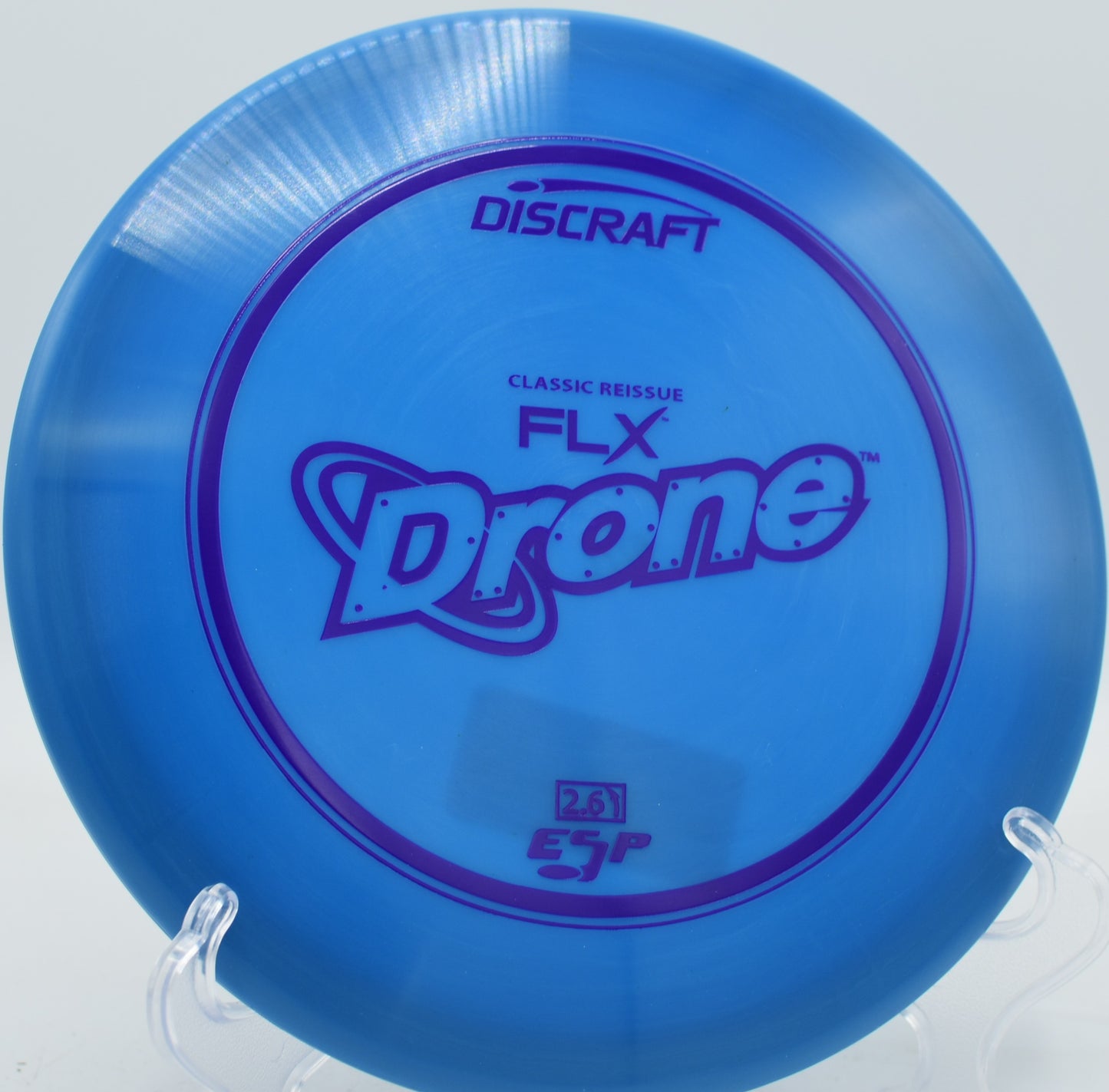 Midrange hammer hyzer with the ESP FLX Drone carving a left-finishing line at Blue Ribbon Pines.

