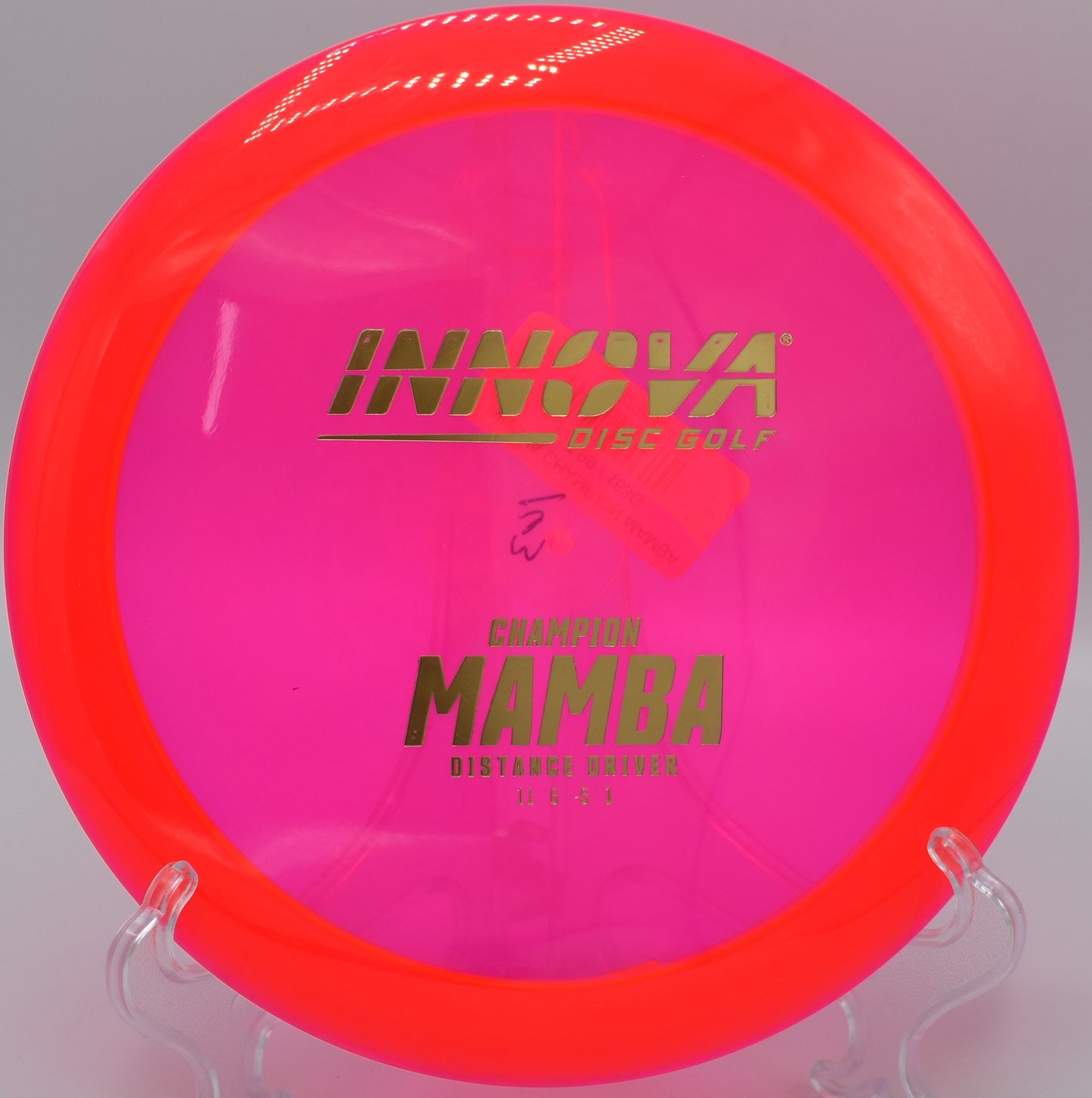 An Innova Champion Mamba flexing out of an anhyzer drive at Water Works Park Disc Golf Course in Kansas City, Missouri, carving a long turnover line.