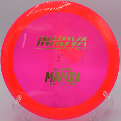 An Innova Champion Mamba flexing out of an anhyzer drive at Water Works Park Disc Golf Course in Kansas City, Missouri, carving a long turnover line.