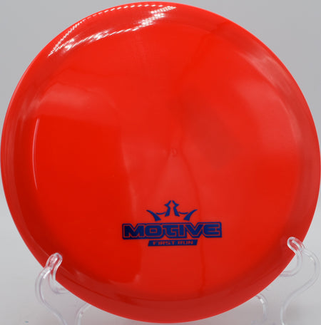 Dynamic Discs Fuzion Motive held in power grip before throw at Brewster Ridge DGC in Jeffersonville, Vermont

