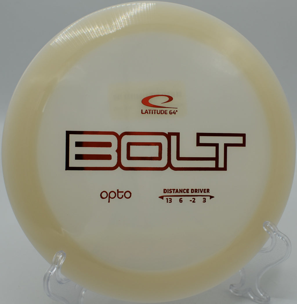 Opto Bolt disc mid-flight across a water hazard at Eagle’s Nest Disc Golf Course.