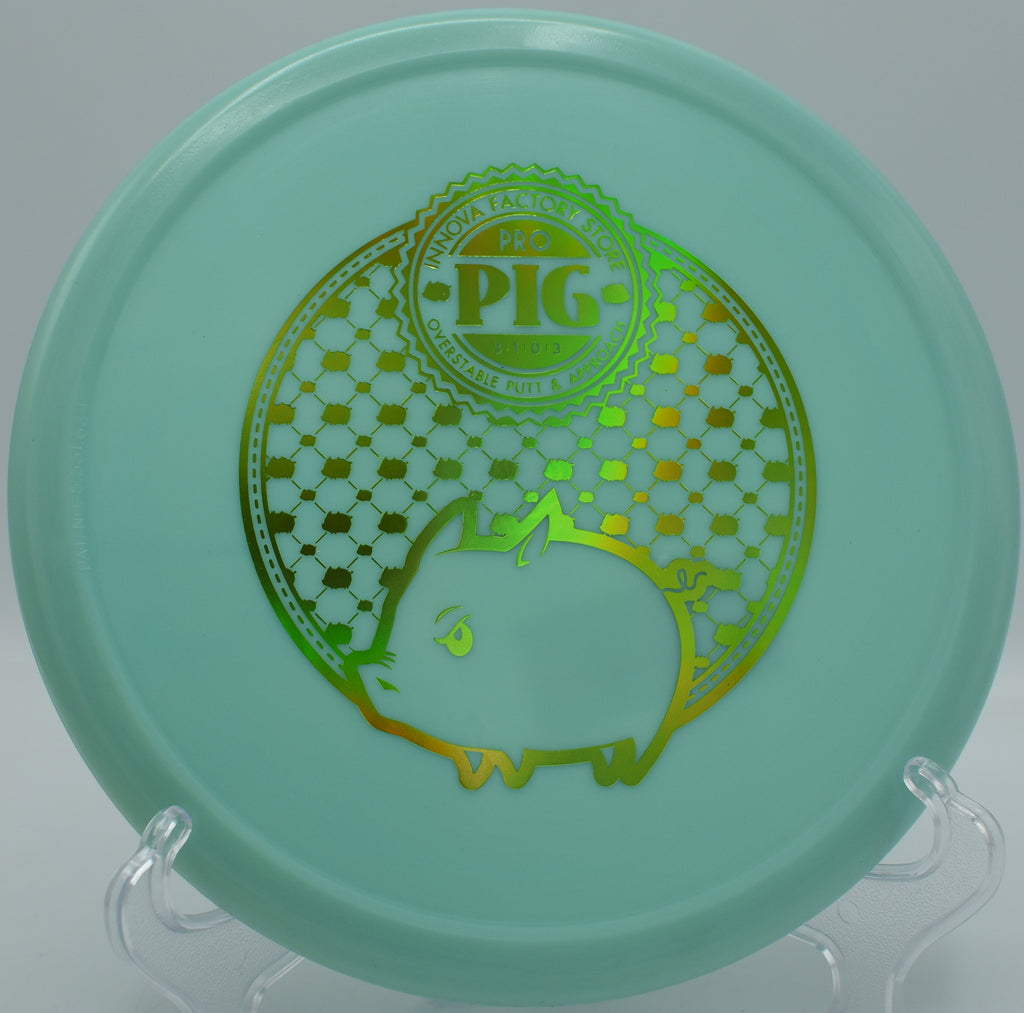 Innova Classic Glow Pig glowing mid-air as it fights wind with a strong fade at Maple Hill in Leicester, Massachusetts.

