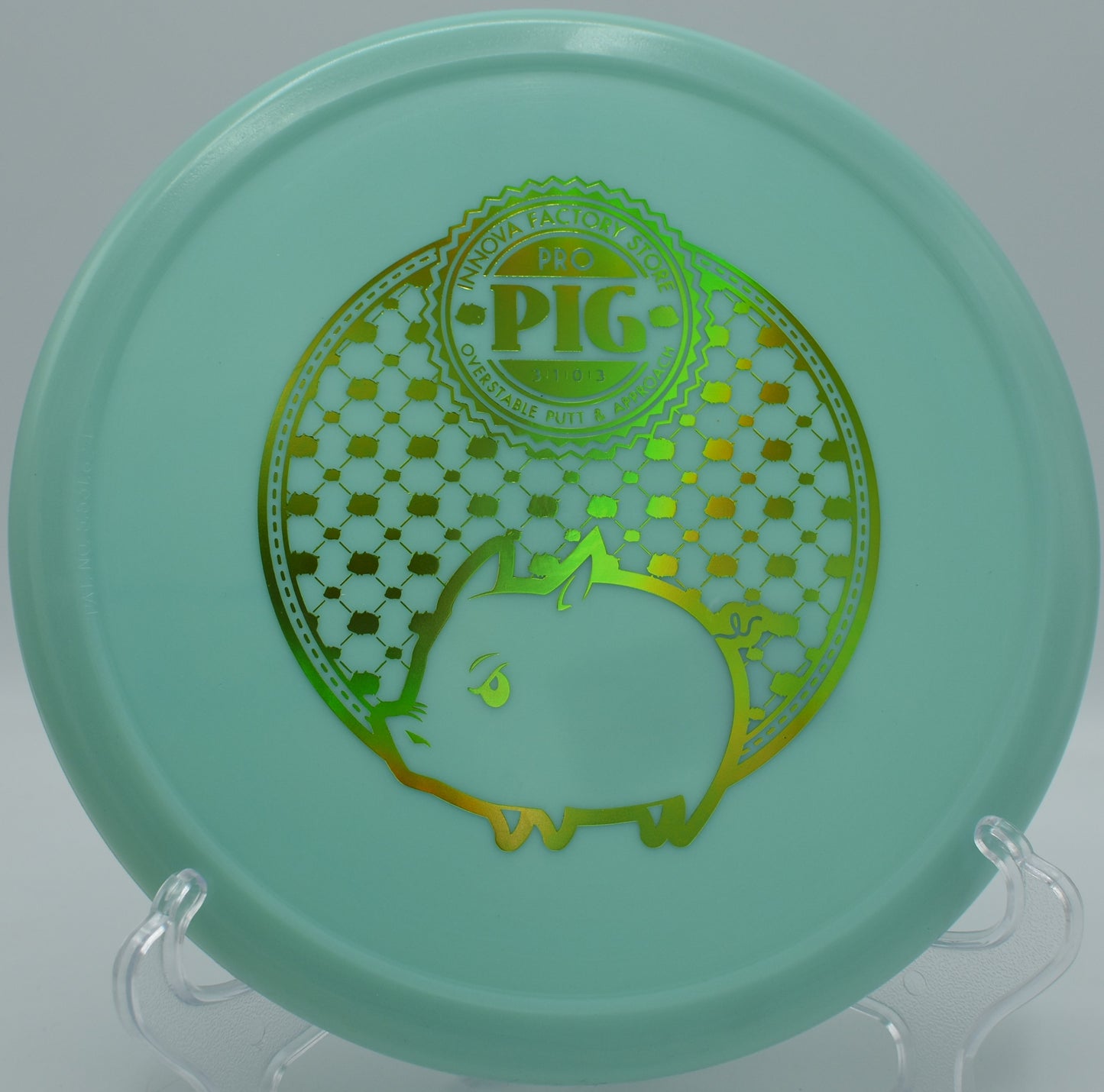 Innova Classic Glow Pig glowing mid-air as it fights wind with a strong fade at Maple Hill in Leicester, Massachusetts.

