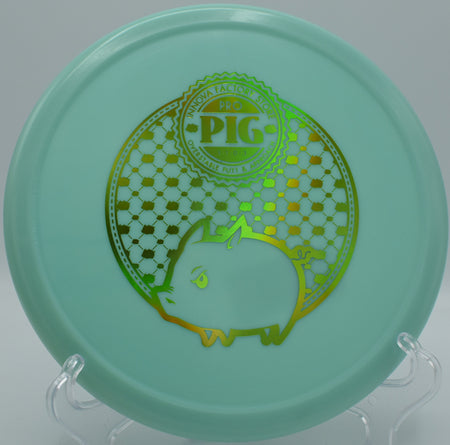 Innova Classic Glow Pig glowing mid-air as it fights wind with a strong fade at Maple Hill in Leicester, Massachusetts.

