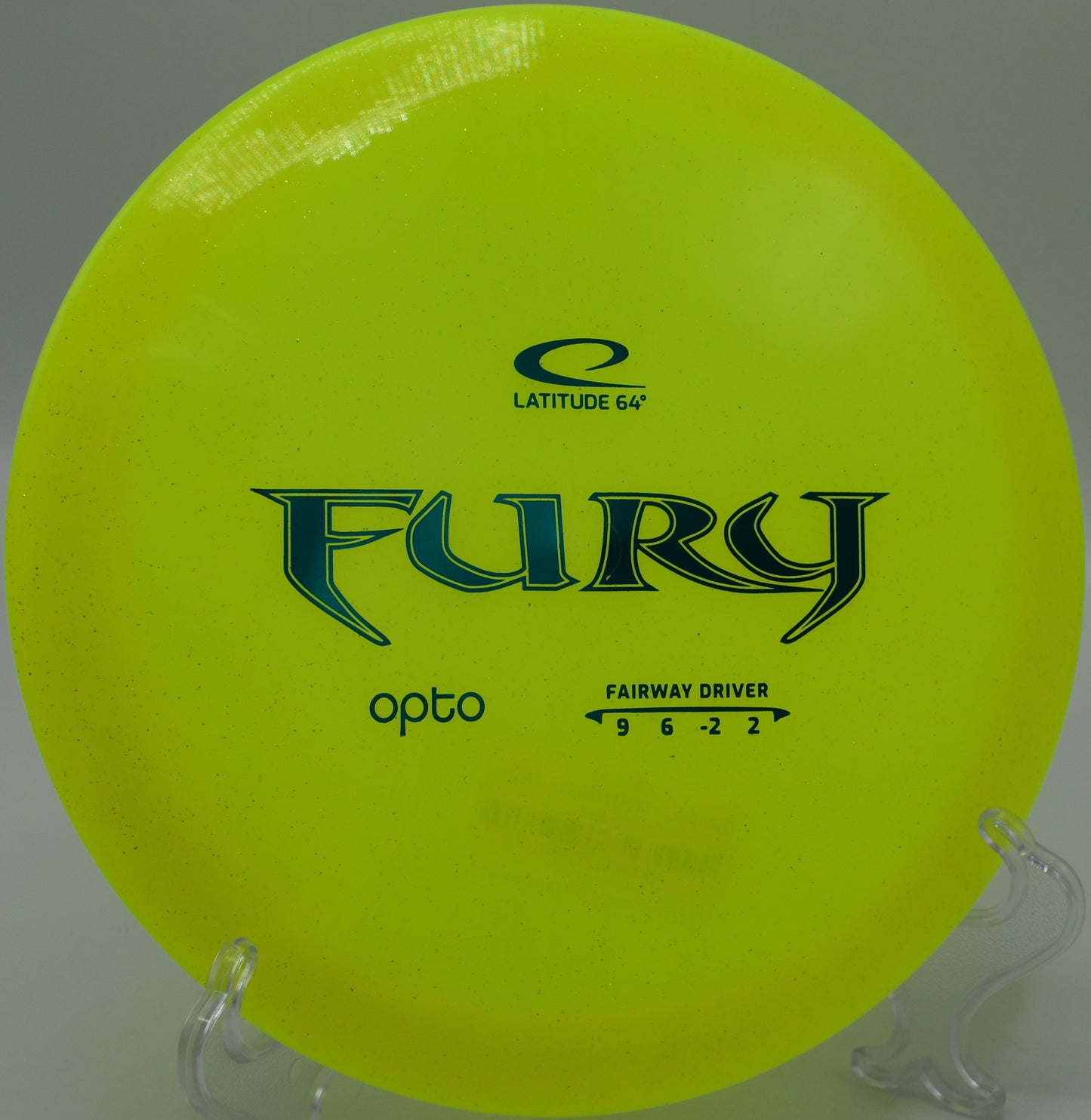 A green Opto Fury disc perched near the basket at Beacon Hill Disc Golf Park, Spokane, Washington.
