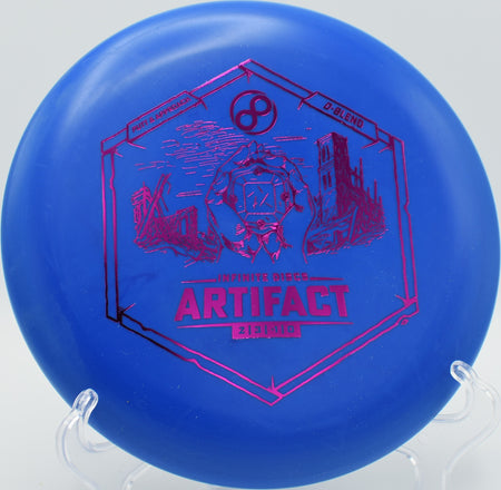 Infinite Discs D-Blend Artifact putter floating gently toward the chains at DeLaveaga Disc Golf Course in Santa Cruz, California, with neutral turn and soft finish.

