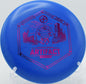 Infinite Discs D-Blend Artifact putter floating gently toward the chains at DeLaveaga Disc Golf Course in Santa Cruz, California, with neutral turn and soft finish.

