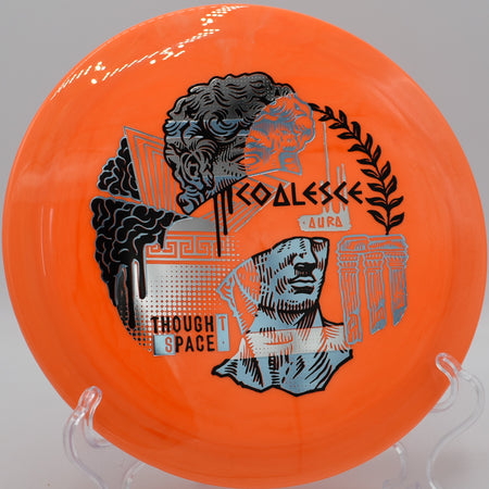 Aura Coalesce gliding through a wooded tunnel at Idlewild Disc Golf Course in Burlington, Kentucky, ideal for placement drives with sharp finishes.

