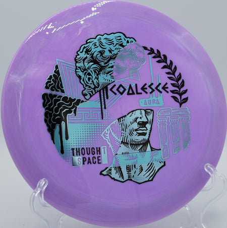 TSA Aura Coalesce resting on the fairway at Hornets Nest DGC in Charlotte, North Carolina, built for controlled power shots and consistent fade.

