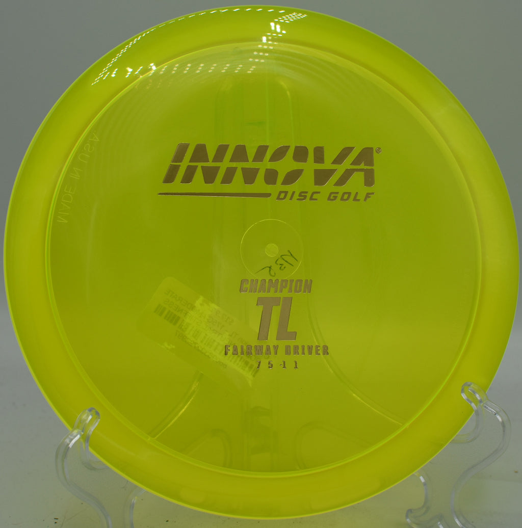 Champion TL riding tailwind and shaping a long fairway drive at North Cove Disc Golf Course in North Carolina.

