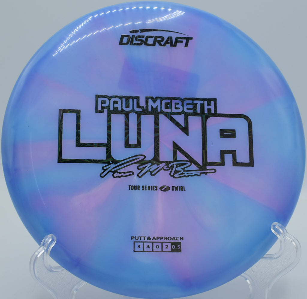 Discraft Luna in Z Swirl plastic floating straight from Circle 2 and clinking chains cleanly.

