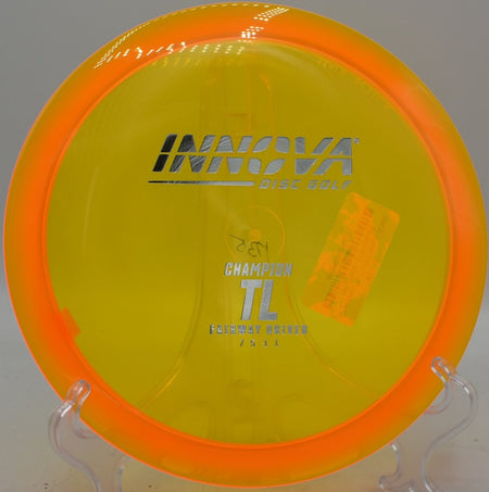 Innova Champion TL driver holding a straight tunnel line toward the basket at Sandy Hollow Disc Golf Course in Rockford, Illinois