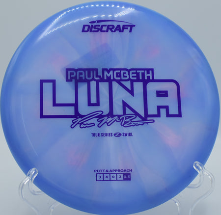 McBeth’s Luna bending slightly around a tree and fading flat at Sabattus Disc Golf Course.

