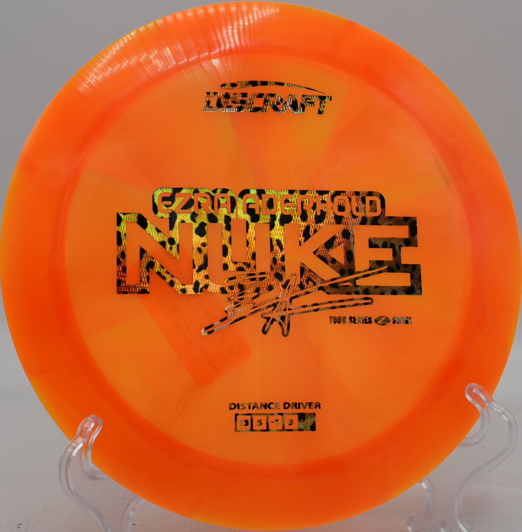 Discraft Z Swirl Nuke flexing out of a high-speed anhyzer, landing softly near the basket at Harmony Bends.

