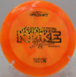 Discraft Z Swirl Nuke flexing out of a high-speed anhyzer, landing softly near the basket at Harmony Bends.

