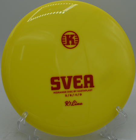 K1 Svea parked near the basket at Idlewild Disc Golf Course in Burlington, Kentucky, highlighting its point-and-shoot flight and soft finish.

