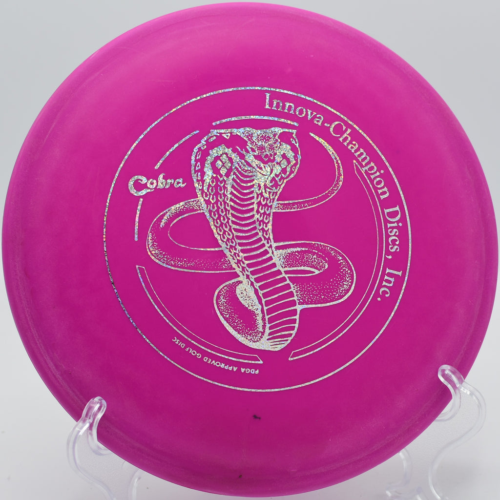 Innova DX Cobra turning over slightly on Hole 12 at Rock Ridge Disc Golf Course, Pittsboro, North Carolina.