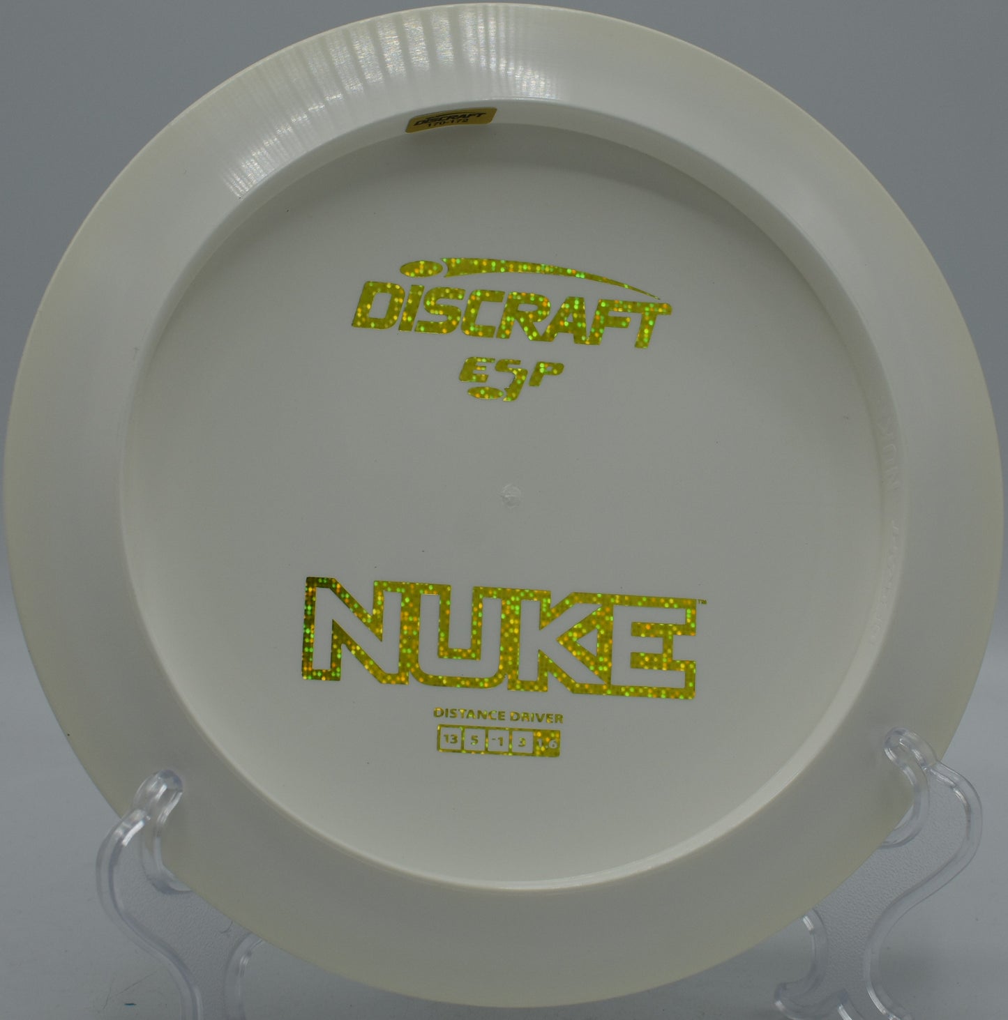 Discraft ESP Nuke showing off solid white profile during a distance drive at SeaTac DGC in SeaTac, Washington

