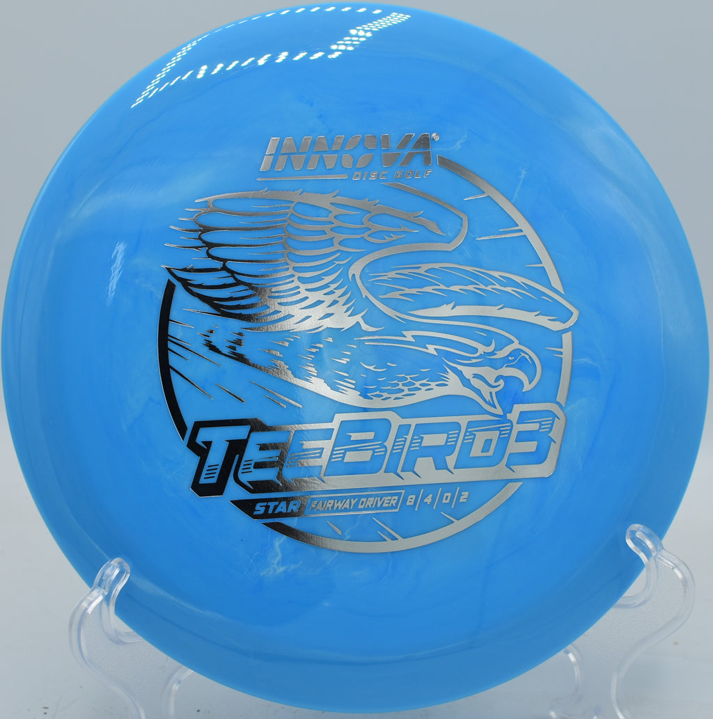 Slow flex backhand shot with a Star TeeBird3 bending through tall pines at Northwood Black in Illinois.

