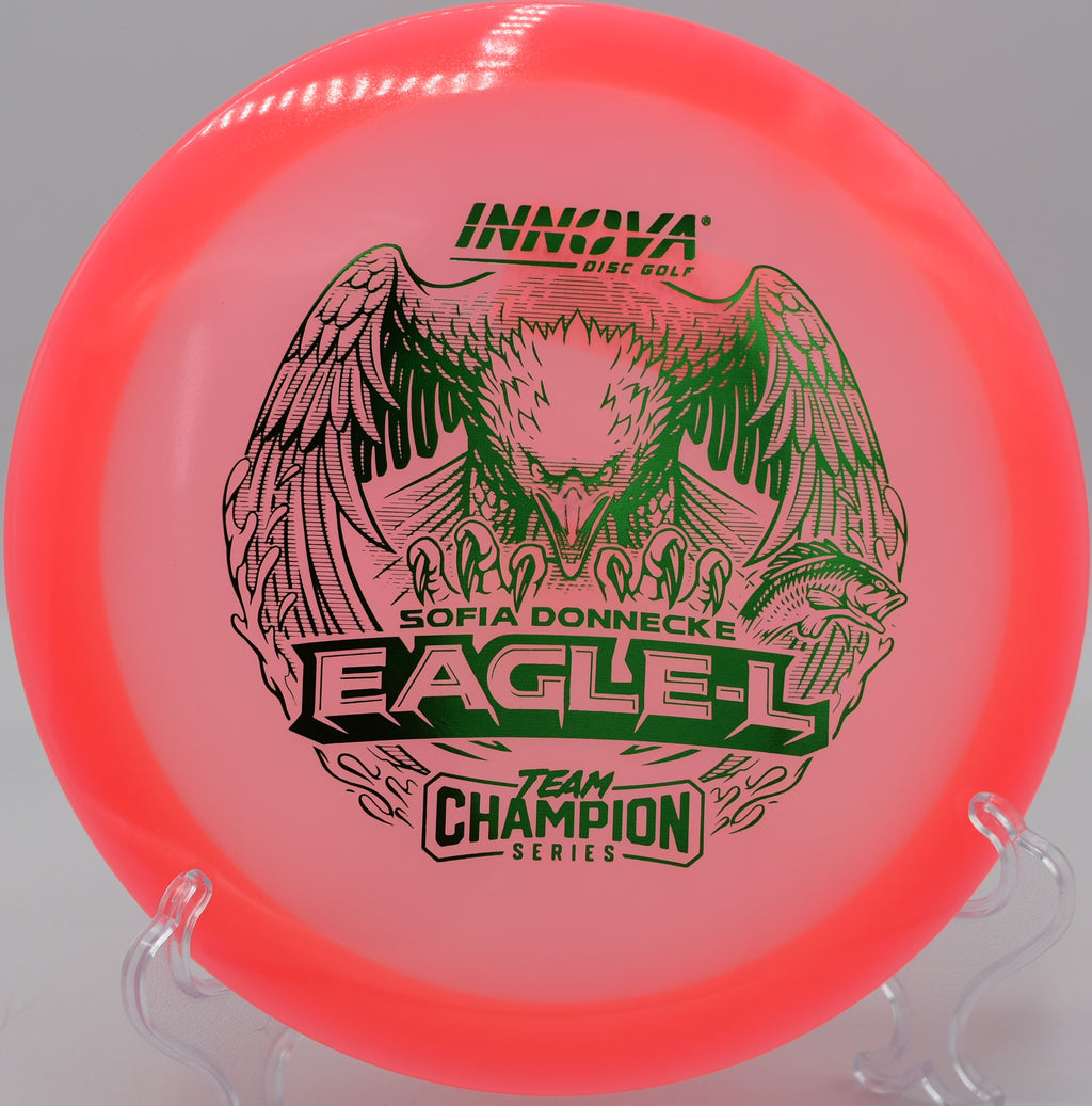 Champion Glow Eagle-L gliding flat through a tight wooded fairway at Trophy Club Park in Trophy Club, Texas.

