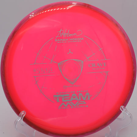 Neutron Crave fairway driver displayed on a grassy disc golf course at Golden Gate Park in San Francisco, California, showcasing its sleek design and high-quality Neutron plastic.