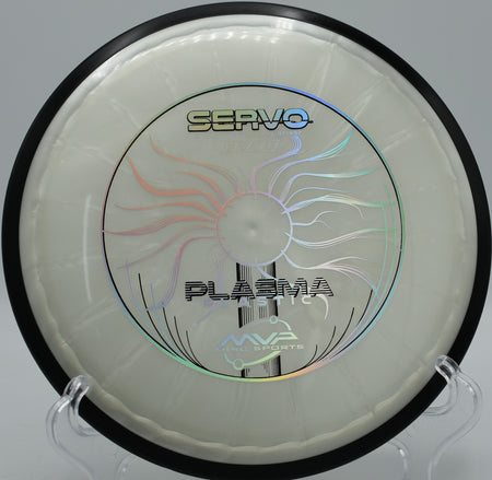 Servo in Plasma plastic resting beside the pin at Sabattus Disc Golf Course in Sabattus, Maine, perfect for tight fairway accuracy.

