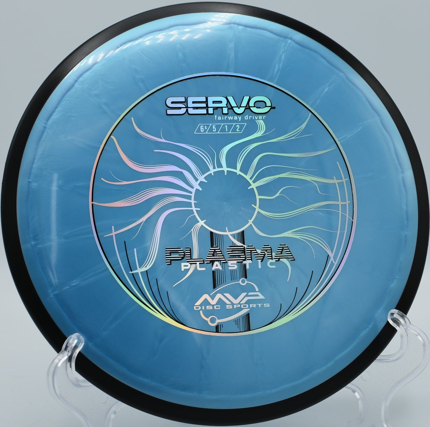 MVP Plasma Servo thrown on a flat line at Flip City Disc Golf Park in Shelby, Michigan, with reliable glide and manageable fade.

