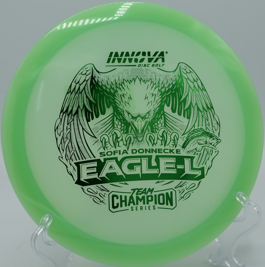 Champion Glow Eagle-L gliding flat through a tight wooded fairway at Nevin Park in Charlotte, North Carolina.

