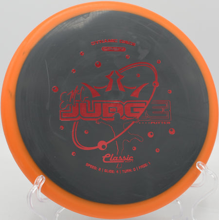 Dynamic Discs EMAC Judge shown in-hand before a jump putt at SeaTac Disc Golf Course in Washington

