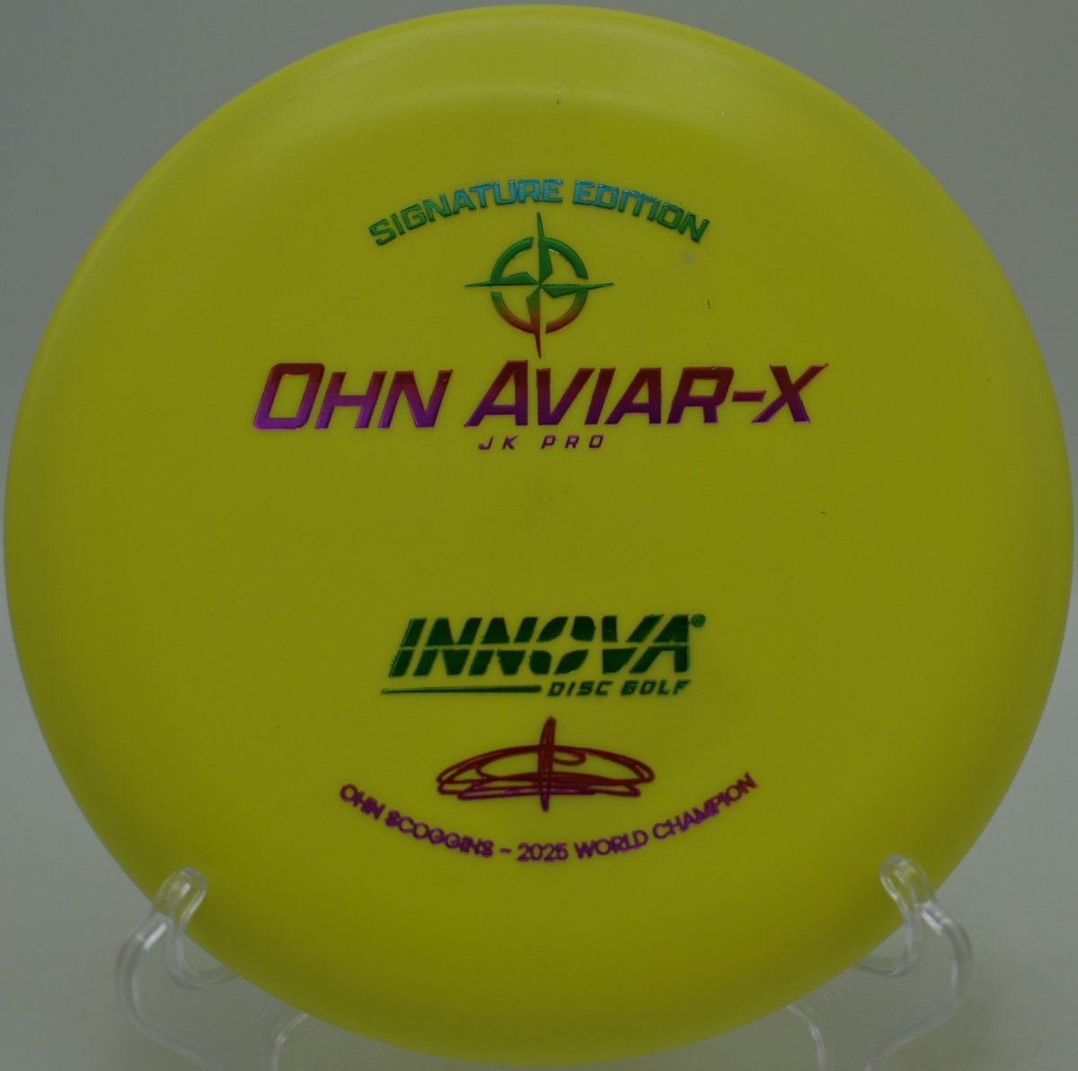 JK Aviar-X putter resting on the putting green beside the cage at La Mirada Regional Park Disc Golf Course in La Mirada, California