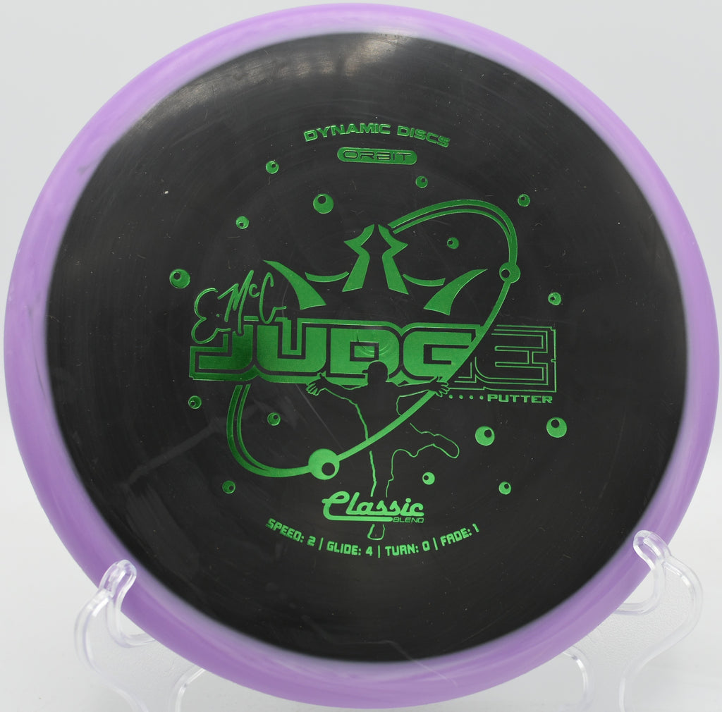 Dynamic Discs Classic Blend Orbit EMAC Judge spinning cleanly toward the chains at Tom Brown Park in Tallahassee, Florida

