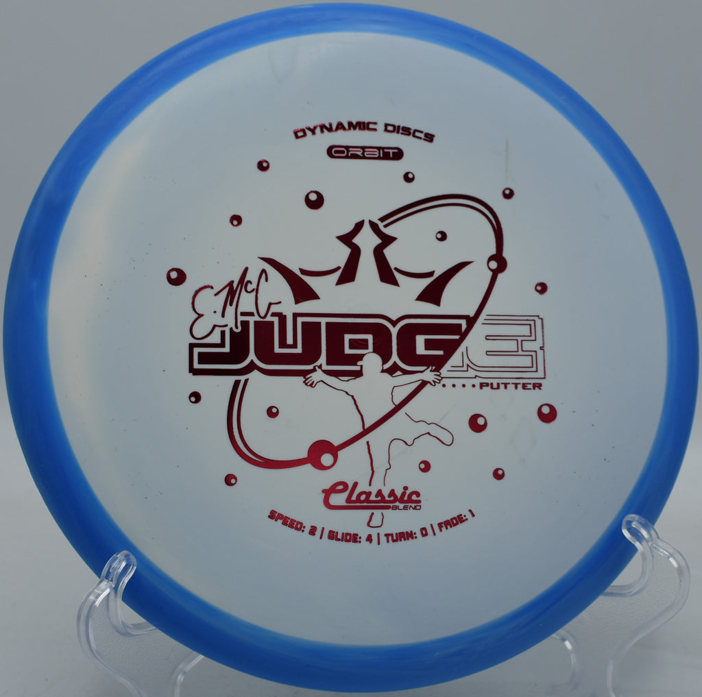 Dynamic Discs EMAC Judge shown mid-putt at SeaTac Disc Golf Course in Washington

