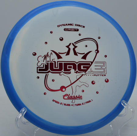 Dynamic Discs EMAC Judge shown mid-putt at SeaTac Disc Golf Course in Washington

