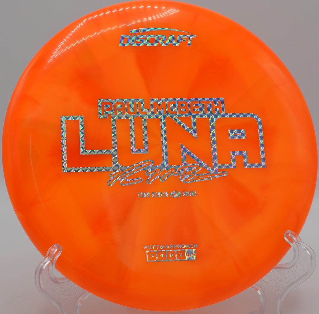 Luna fading out at the base of a guarded basket after a flat release at Rockwall Disc Golf Course in Texas.

