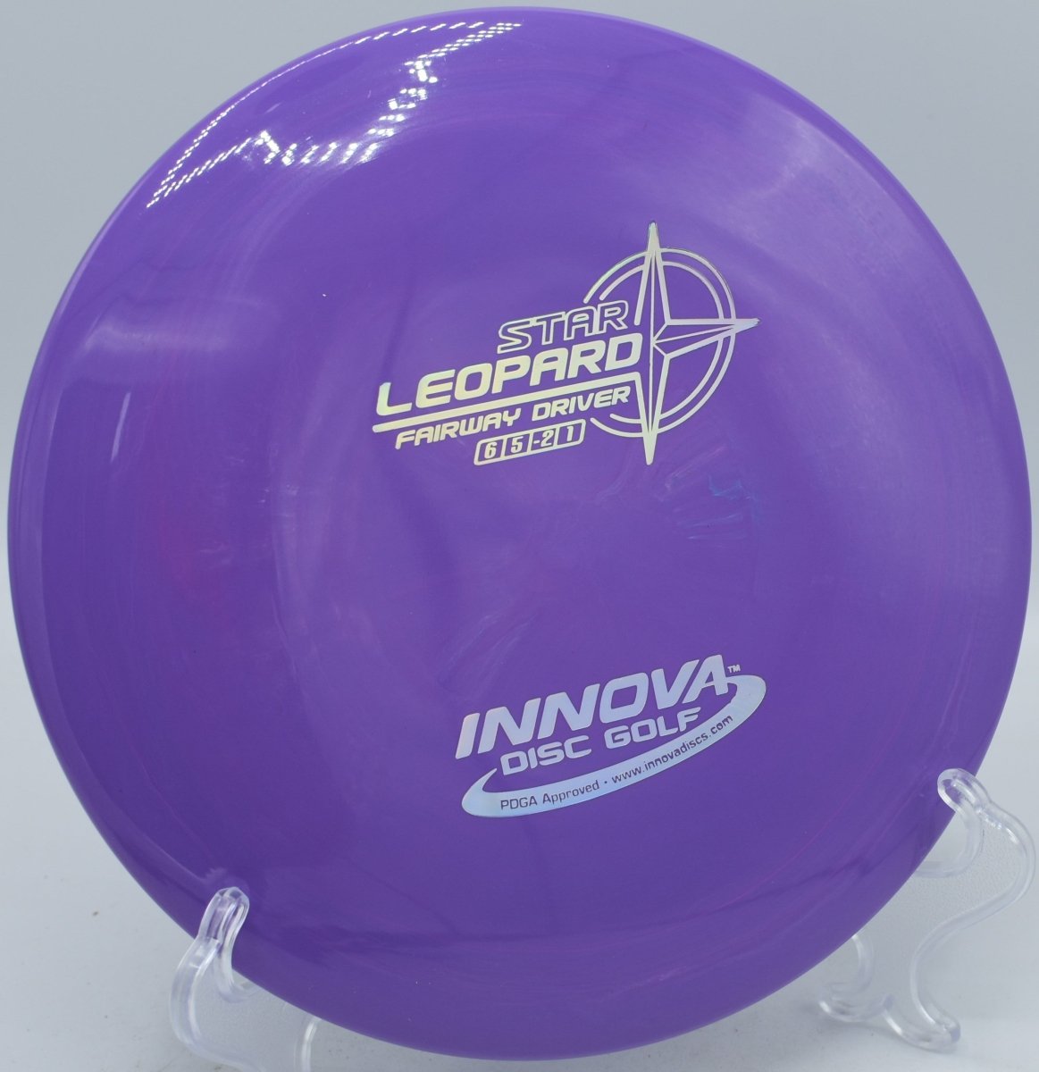 Star Leopard fairway driver gliding straight down a tight tunnel shot at Lakeshore Disc Golf Course in Ypsilanti, Michigan