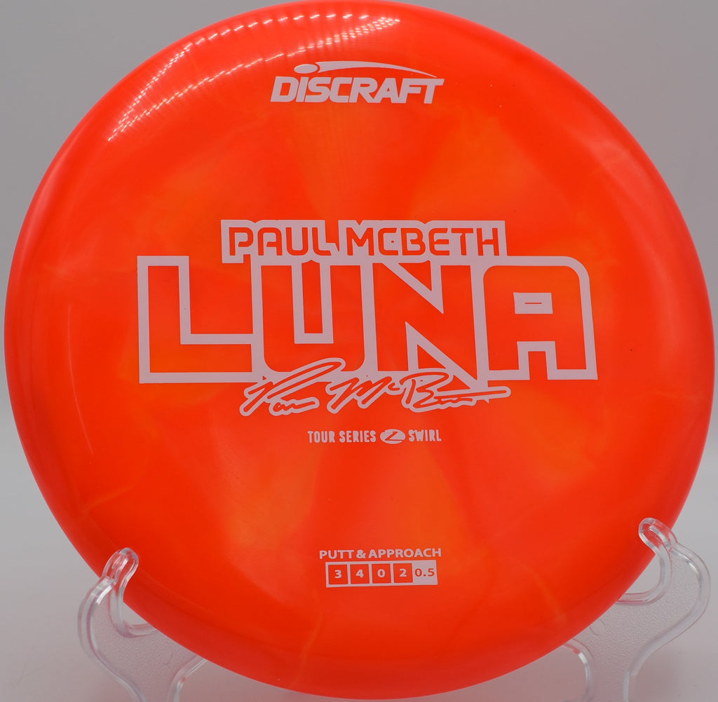 Swirl Luna floating nose-up on a stall putt and catching chains at Blue Mountain Disc Golf Course in Palmerton, PA.

