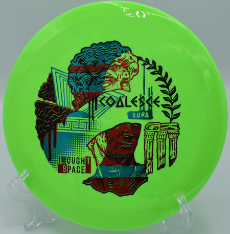 Aura Coalesce control driver flying on a sweeping hyzer at Maple Hill Disc Golf Course in Leicester, Massachusetts, offering dependable fade and glide.

