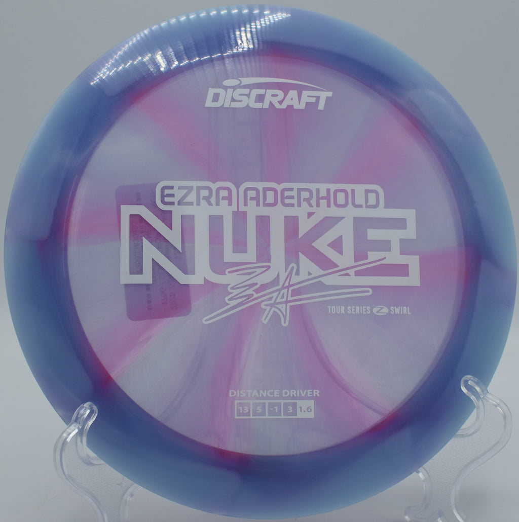 Discraft Z Swirl Nuke ripping overstable through headwind at Harmony Bends with torque-resistant flight.

